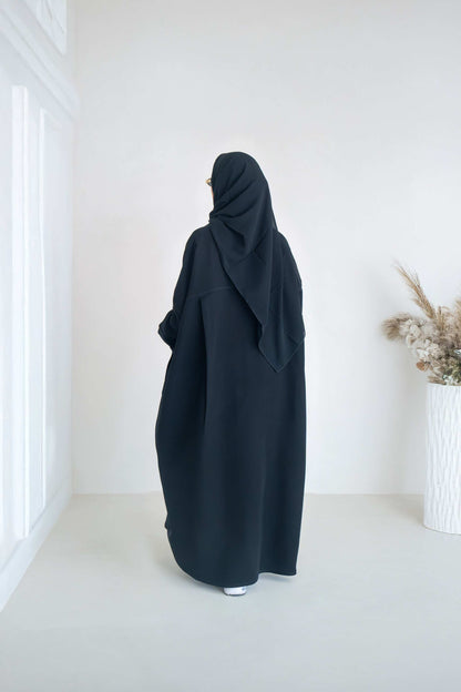 luxurious black crepe abaya with loose fit and elegant design for formal and everyday wear