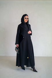 Elegant black abaya with velvet lapels and asymmetrical overlay, perfect for evening occasions