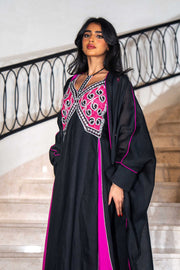 Black dress with magenta panels and butterfly-style embroidered neckline paired with matching black bisht with contrast piping