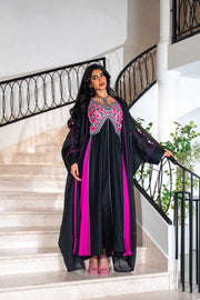 Black dress with magenta panels and butterfly-style embroidered neckline paired with matching black bisht with contrast piping