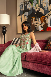 Soft pastel green one-piece dress with floral embroidery and blush pink cape sleeves, perfect for spring and summer.