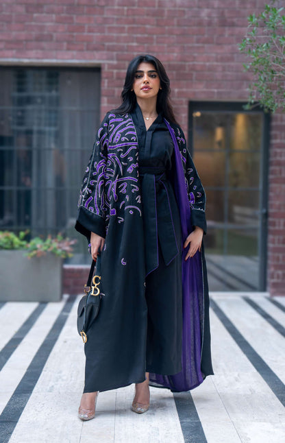 Elegant black bisht with purple chiffon lining and intricate purple Arabic calligraphy embroidery.