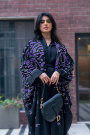 Elegant black bisht with purple chiffon lining and intricate purple Arabic calligraphy embroidery.
