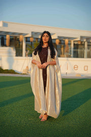 Elegant Opal dress with rich brown base and luminous beige bisht featuring pearl-like embellishments for formal and festive occasions