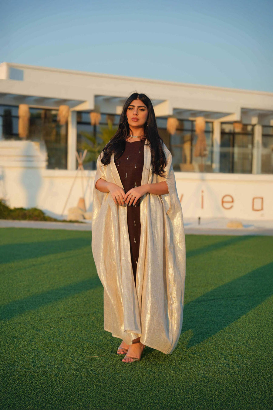 Elegant Opal dress with rich brown base and luminous beige bisht featuring pearl-like embellishments for formal and festive occasions