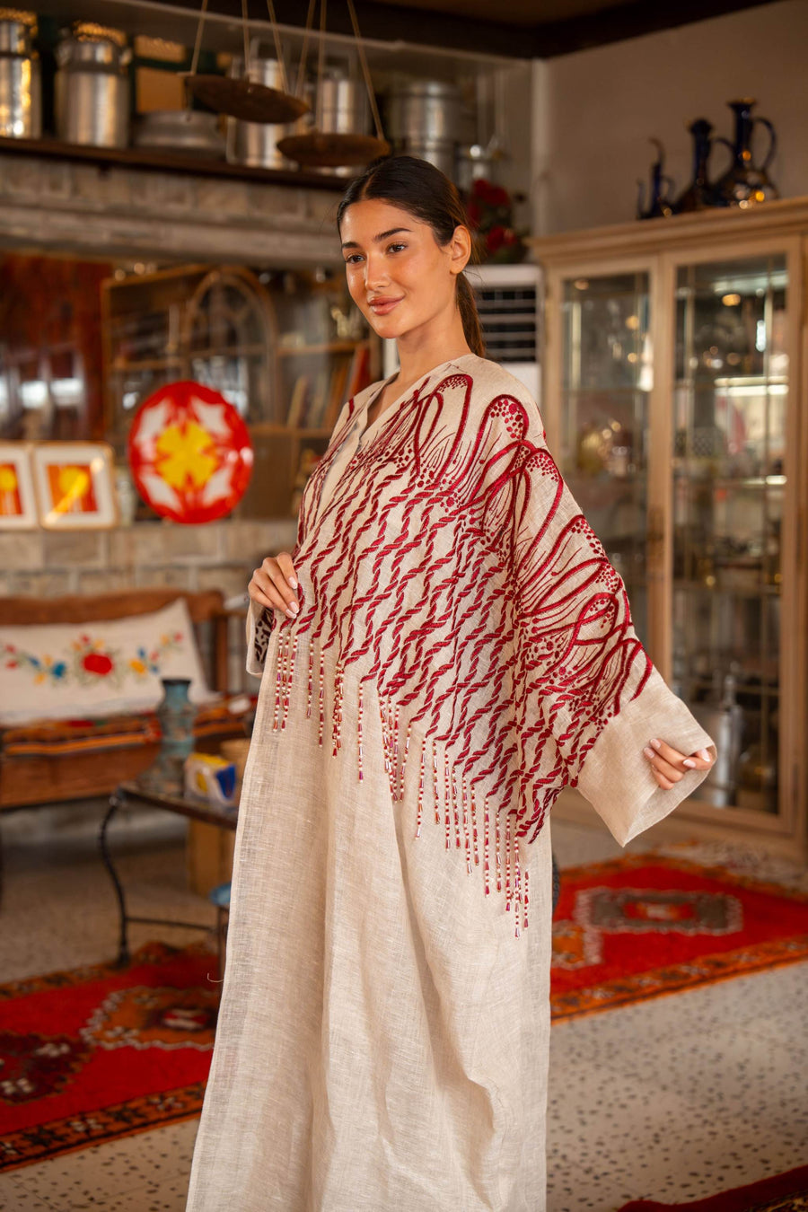 Beige bisht with bold red embroidery on shoulders and sleeves, elegant textured fabric for special occasions
