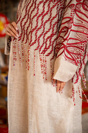Beige bisht with bold red embroidery on shoulders and sleeves, featuring intricate flowing patterns and bead fringes.