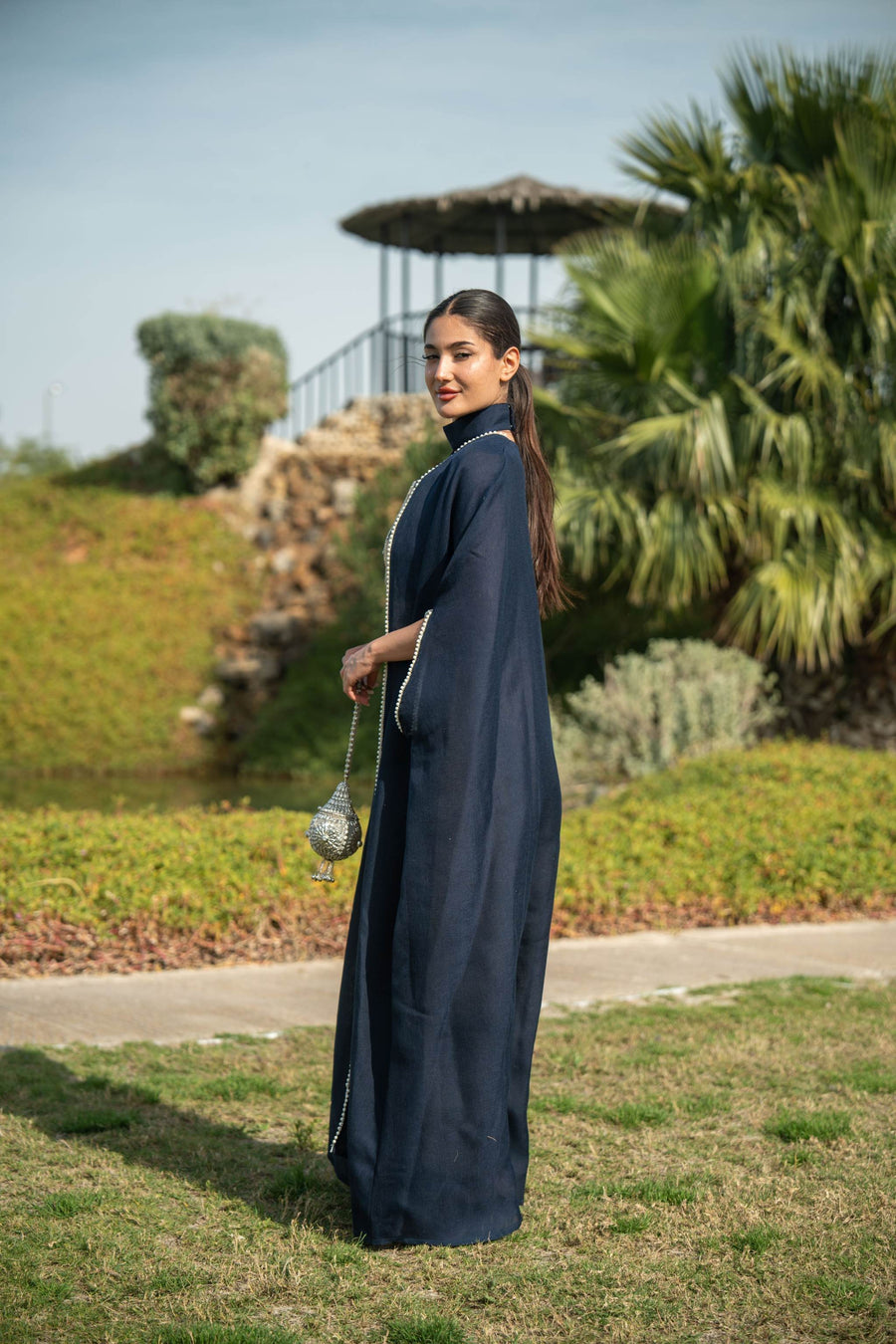 Elegant navy blue bisht with beige lining and delicate piping, perfect for day and evening wear.