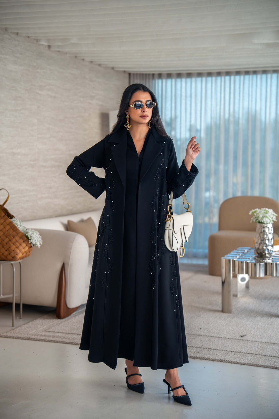 Velira black crepe abaya with delicate dot pattern embroidery and flowing silhouette.