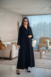 Velira black crepe abaya with delicate dot pattern embroidery and flowing silhouette for elegant everyday or special occasion wear
