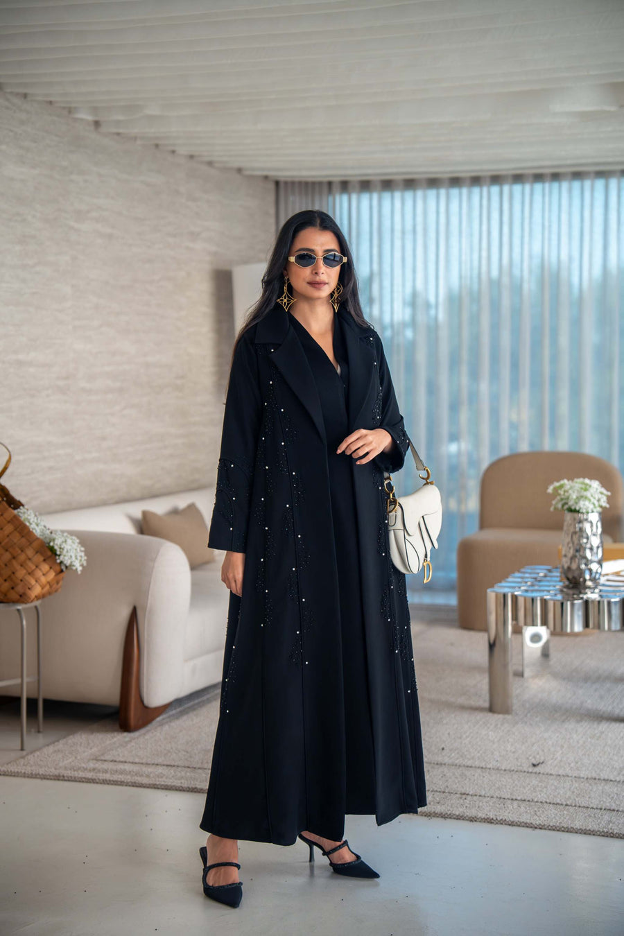 Velira black crepe abaya with delicate dot pattern embroidery and flowing silhouette for elegant everyday or special occasion wear