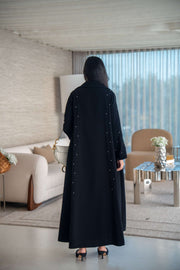 Velira black crepe abaya with delicate dot pattern embroidery and flowing silhouette