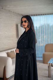 Velira black crepe abaya with delicate dot pattern embroidery and flowing silhouette