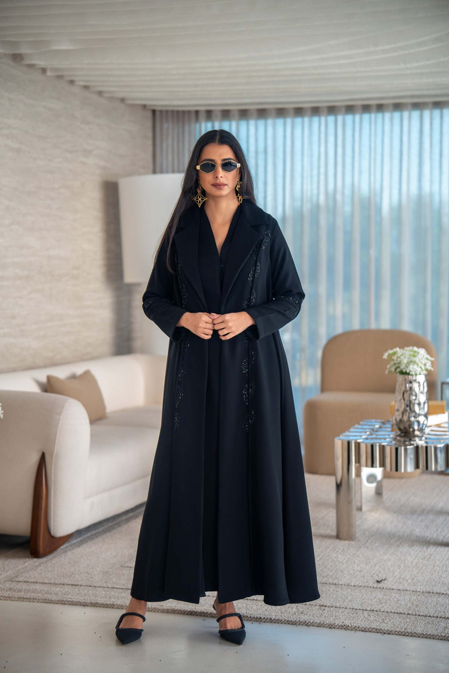 Elegant black crepe abaya with flowing silhouette and lightweight texture for versatile everyday and special occasion wear