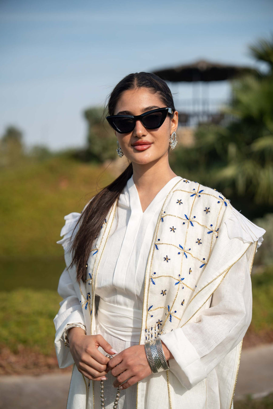 Elegant white abaya with intricate hand embroidery and flowing fabric, perfect for special occasions and everyday wear