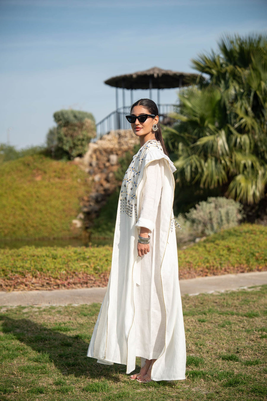 Elegant white abaya with intricate hand embroidery and flowing fabric, perfect for special occasions and everyday wear