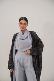 Elegant dark-toned silk abaya with relaxed wide cut, open front, soft lapel, and subtle pattern for graceful, lightweight comfort