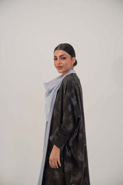 woman wearing Selva silk abaya with relaxed wide cut and subtle dark pattern
