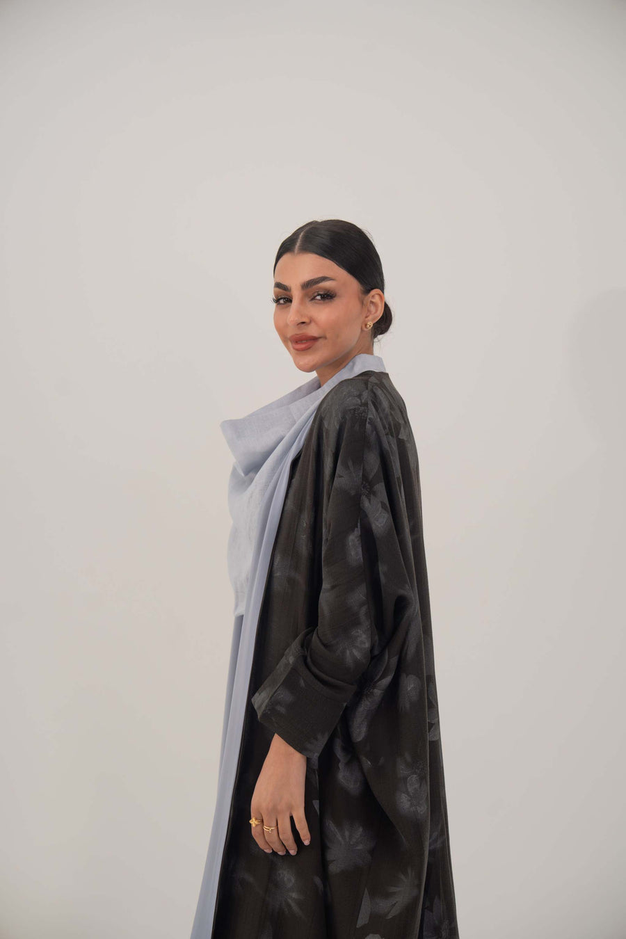 woman wearing Selva silk abaya with relaxed wide cut and subtle dark pattern