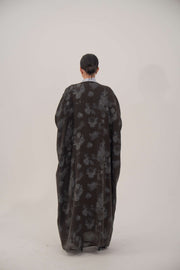 Silk Selva abaya with wide cut and subtle dark floral pattern, open front and long sleeves.