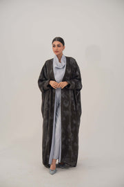 Silk Selva abaya with wide relaxed cut, open front, soft lapel, long sleeves, and subtle dark pattern for elegant flow