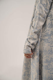 close-up of jacquard silk abaya sleeve with soft elegant pattern in blue and beige