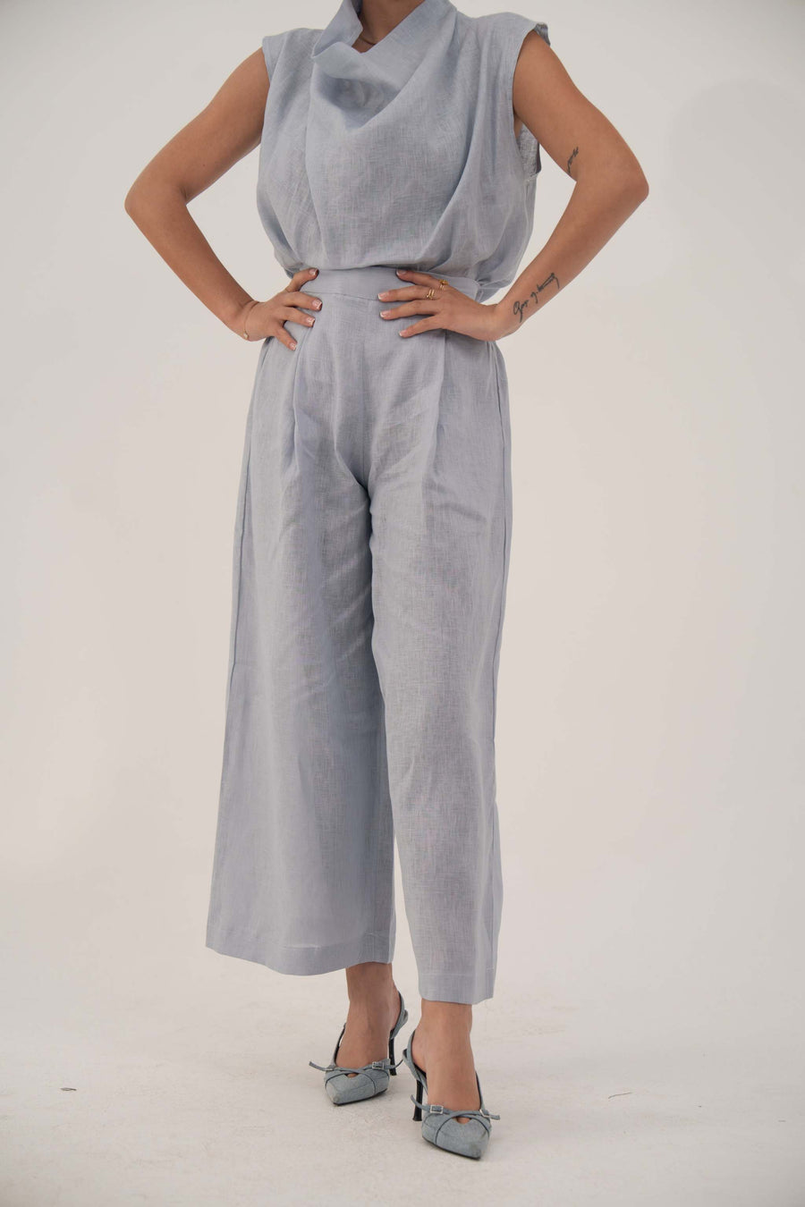Light blue wide-leg linen pant with high waist and cropped ankle length for a modern, breathable look