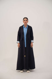 Abaya made from soft linen blend with longline blazer cut, deep navy tone, and folded blue pinstriped cuffs.