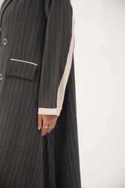 Elegant double-breasted pinstripe blazer-style abaya with off-white cuffs and tailored crepe fabric