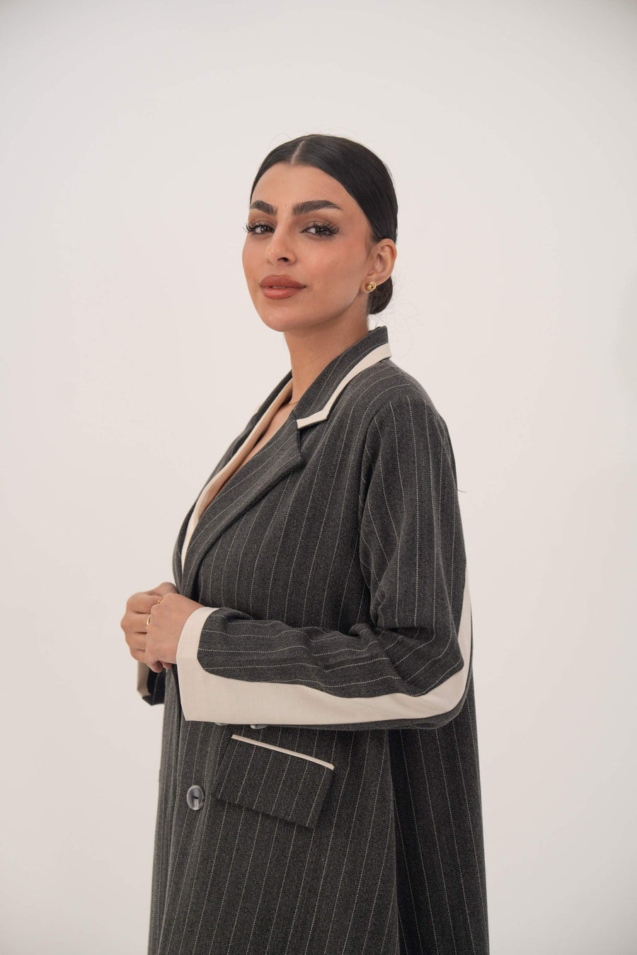Elegant Ashmood blazer-style abaya in premium crepe with white pinstripes and off-white cuff accents.