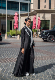 Black tailored blazer abaya with sharp lapels and white piping for a polished modern look