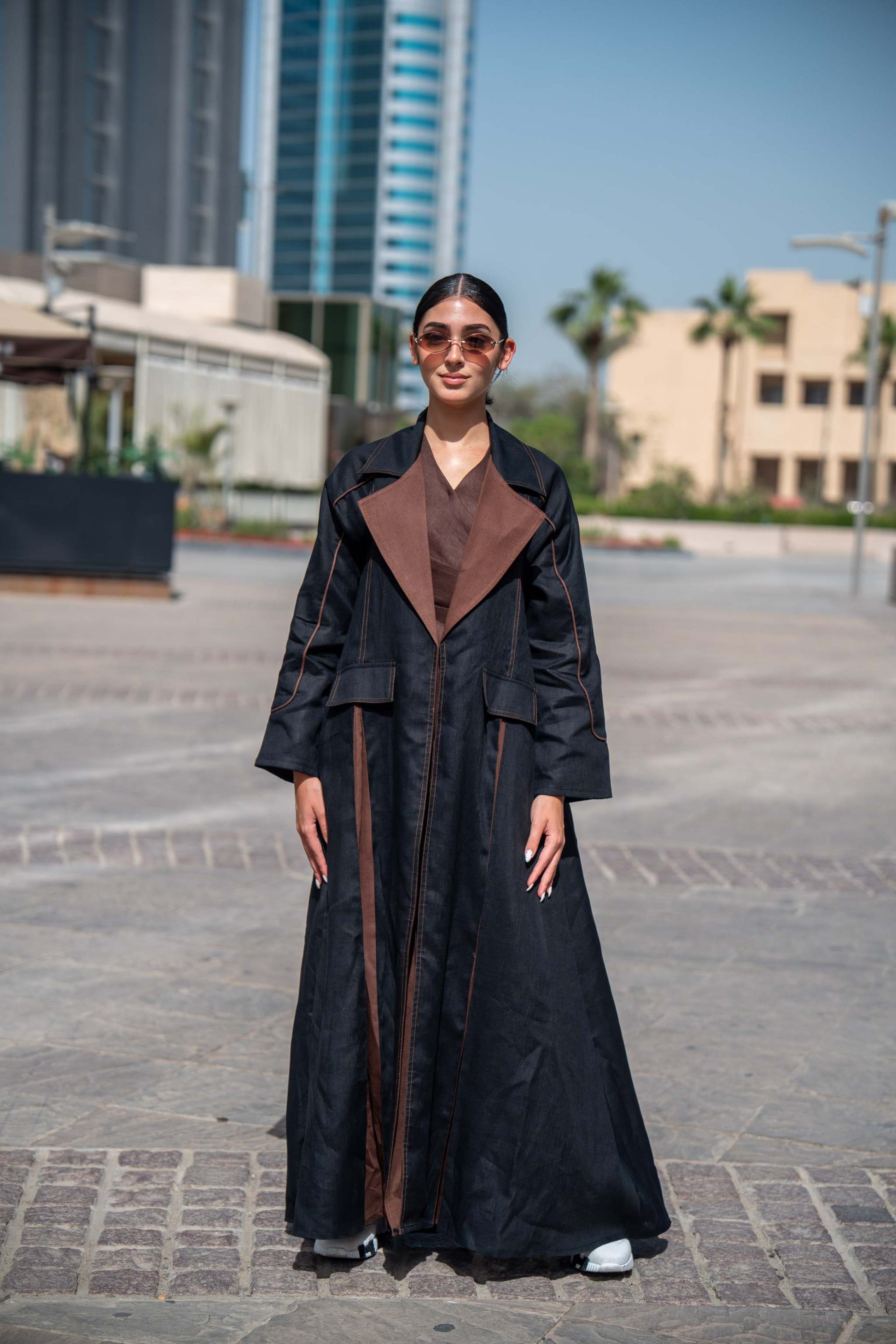 Black and brown linen Velora abaya with wide lapels and modern street-style design.