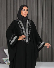 Elegant black bisht with silver hand embroidery on crepe fabric, featuring a flowing, free-size silhouette.