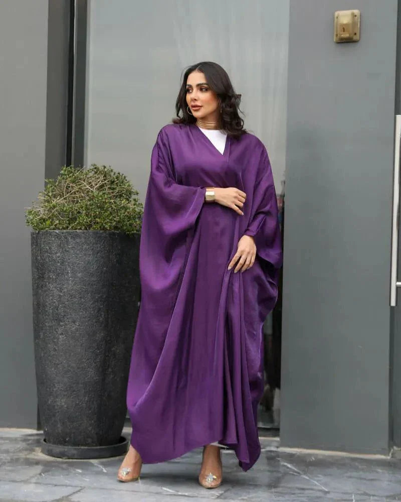 Elegant purple abaya made of shimmering silk with a loose, flowing free-size fit for casual or formal wear