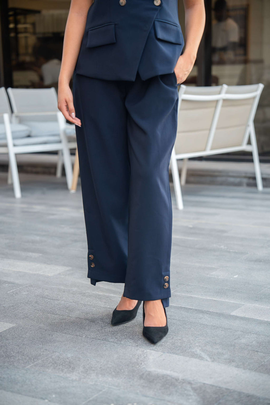 Women's 802 navy blue formal pants with button details at the hem