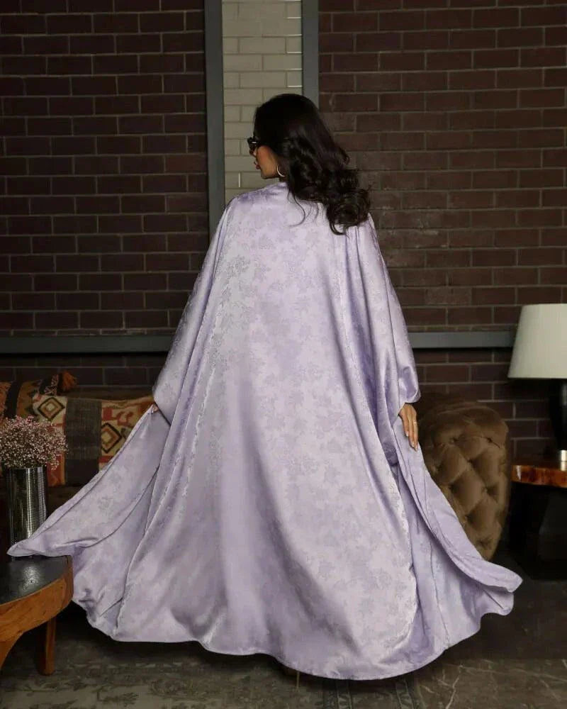 woman wearing soft and elegant mauve bisht with silky fabric and fluid drape - soft and elegant bisht