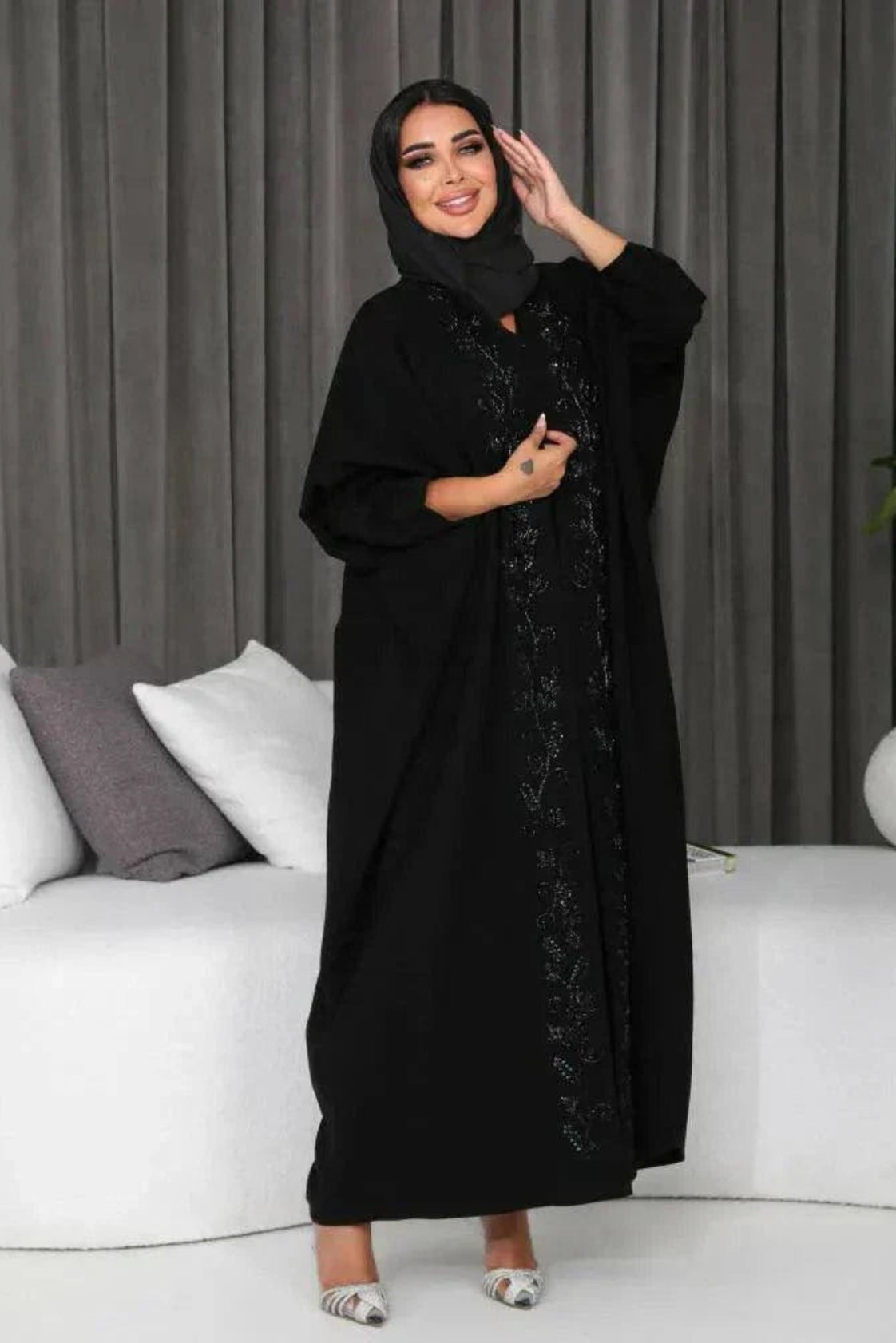 woman wearing elegant black bisht with hand embroidery in soft crepe fabric