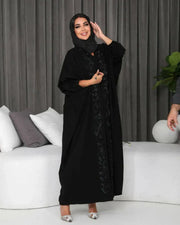 woman wearing elegant black bisht with hand embroidery in soft crepe fabric