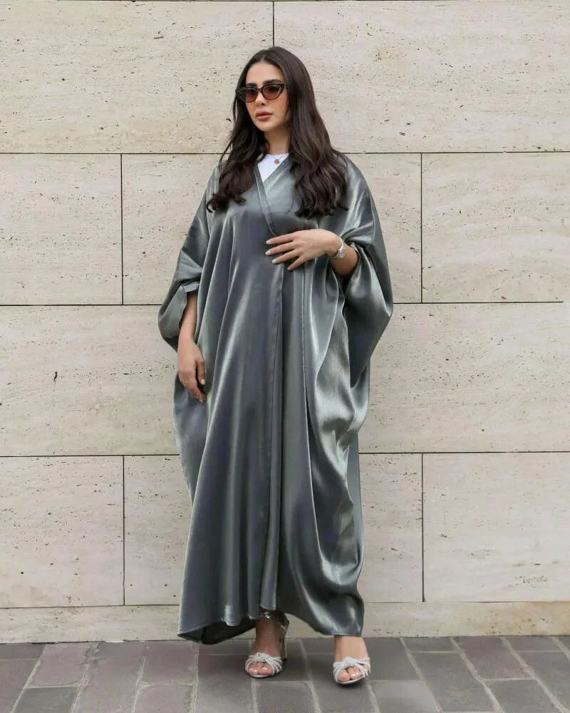 Woman wearing freesize bisht made of shimmering silver silk with a soft drape and radiant glow