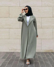 Sage green Palmis abaya with structured lapel collar and single front button made from flowy crepe fabric for modest daily wear