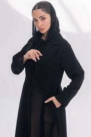 Black crepe blazer abaya with tailored silhouette and subtle embroidery, styled with matching black crepe inner and pants.