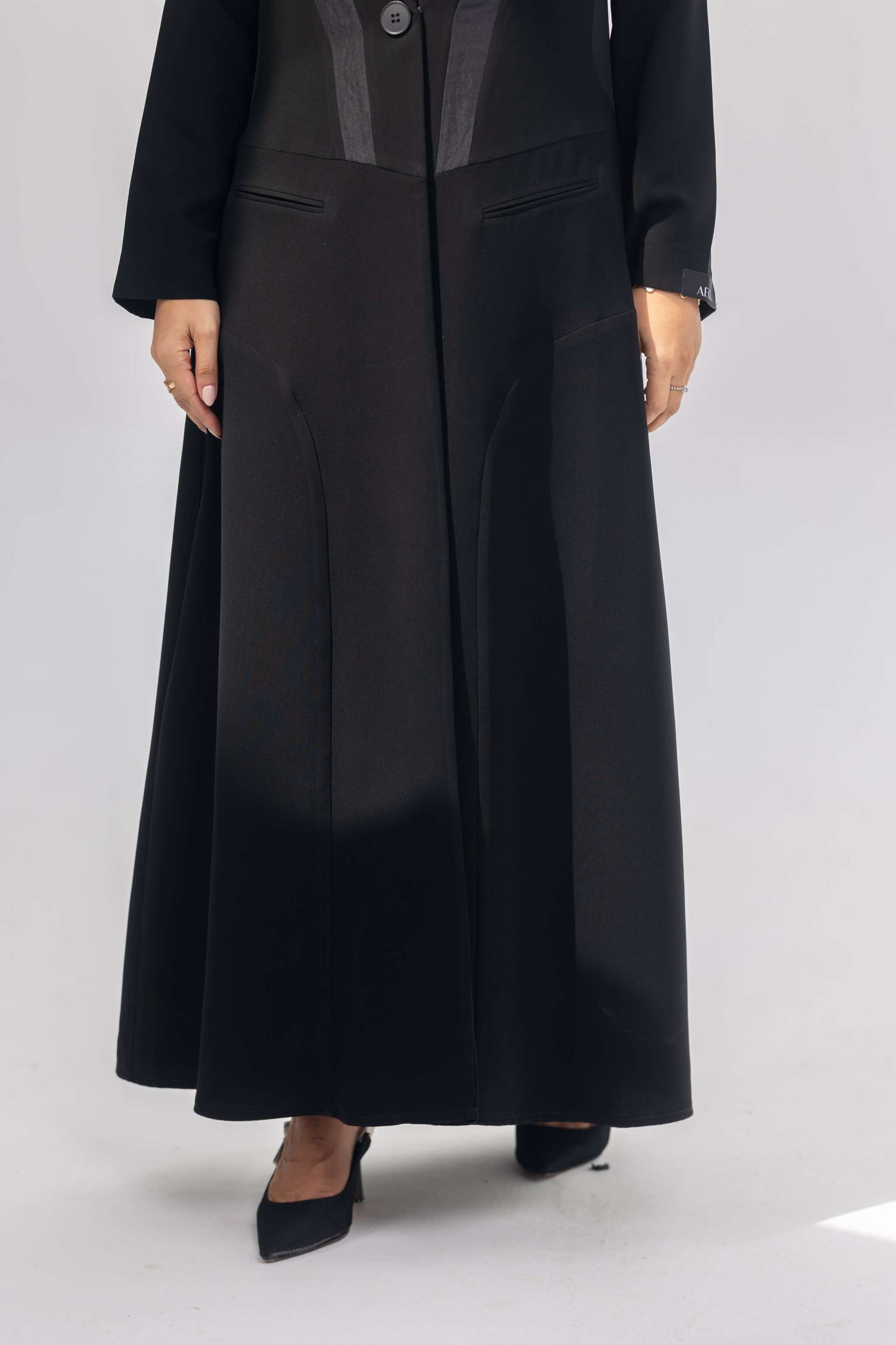 Elegant black crepe abaya with dark grey accents and silk lining for comfort and style