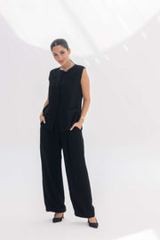 Woman wearing black crepe inner set with embroidered details, styled for a sleek silhouette and elegant comfort.