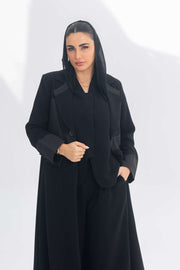 Black crepe blazer abaya with contrasting fabric detail, elegant and modern silhouette for formal and daily wear.