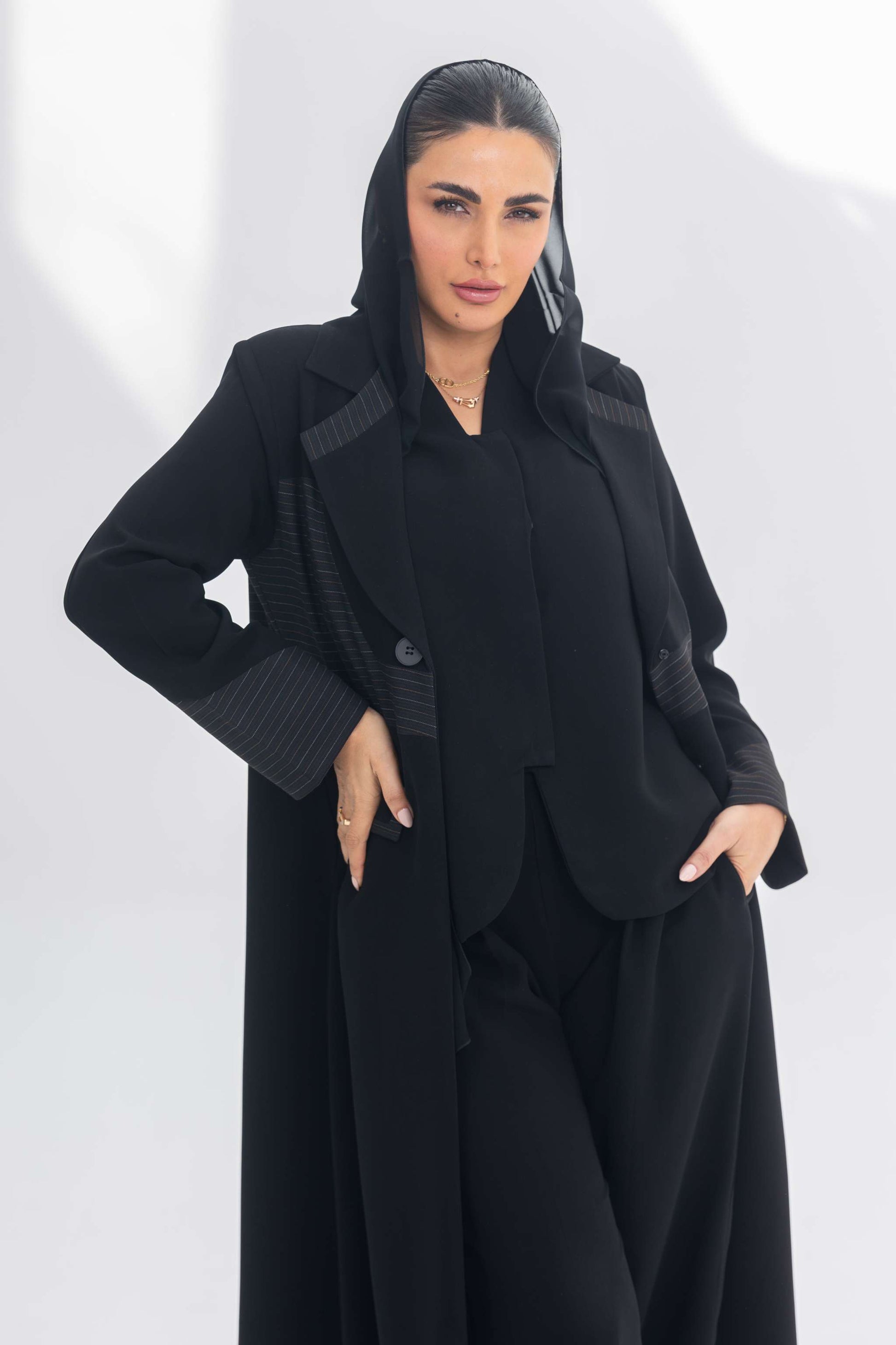 Elegant black crepe blazer abaya with contrasting textured fabric for a sophisticated and versatile look