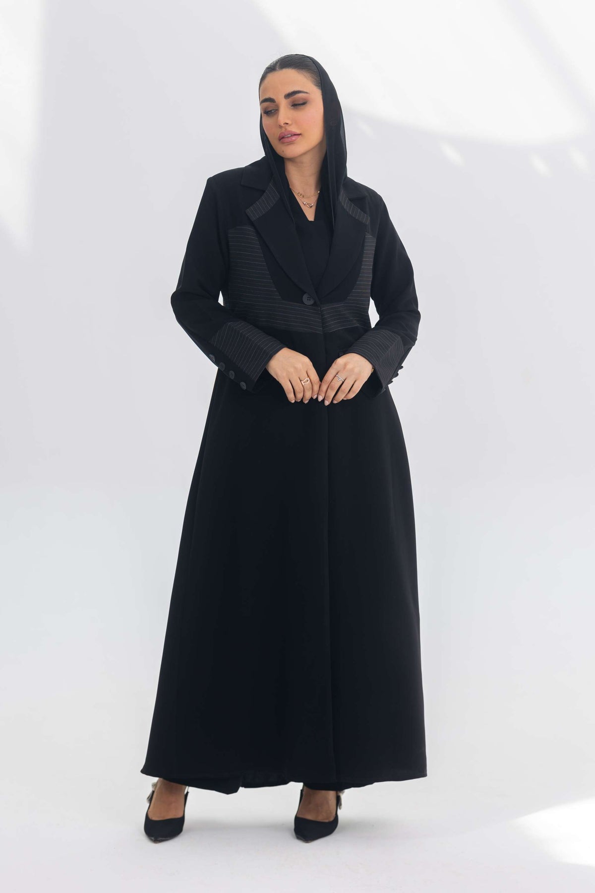 Black crepe blazer abaya with contrasting fabric detail, elegant and modern design for formal and daily wear.