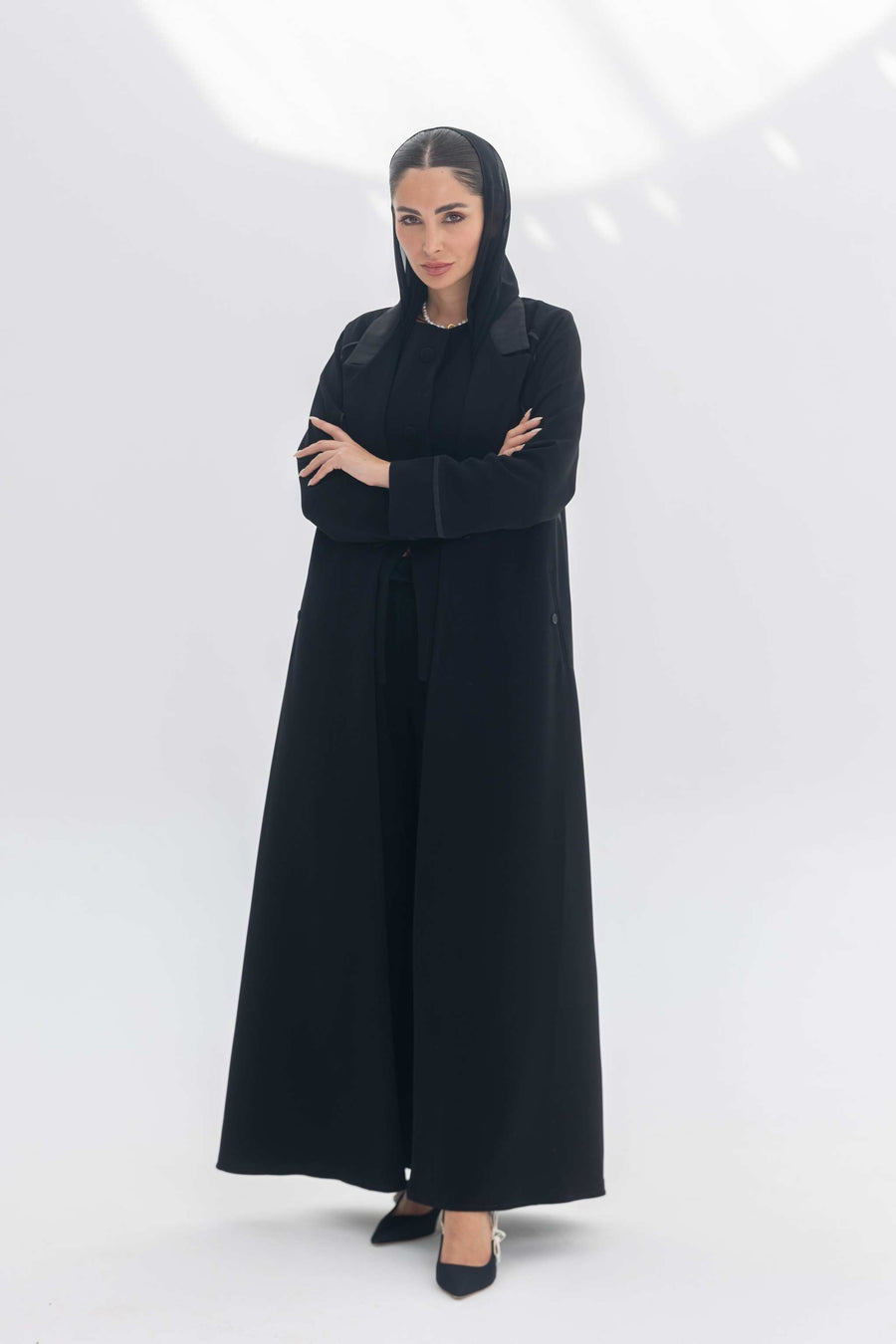 Noira Belle black crepe abaya with striped satin panels and modern elegant design