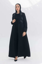 Noira Belle black crepe abaya with striped satin panels and modern elegant design