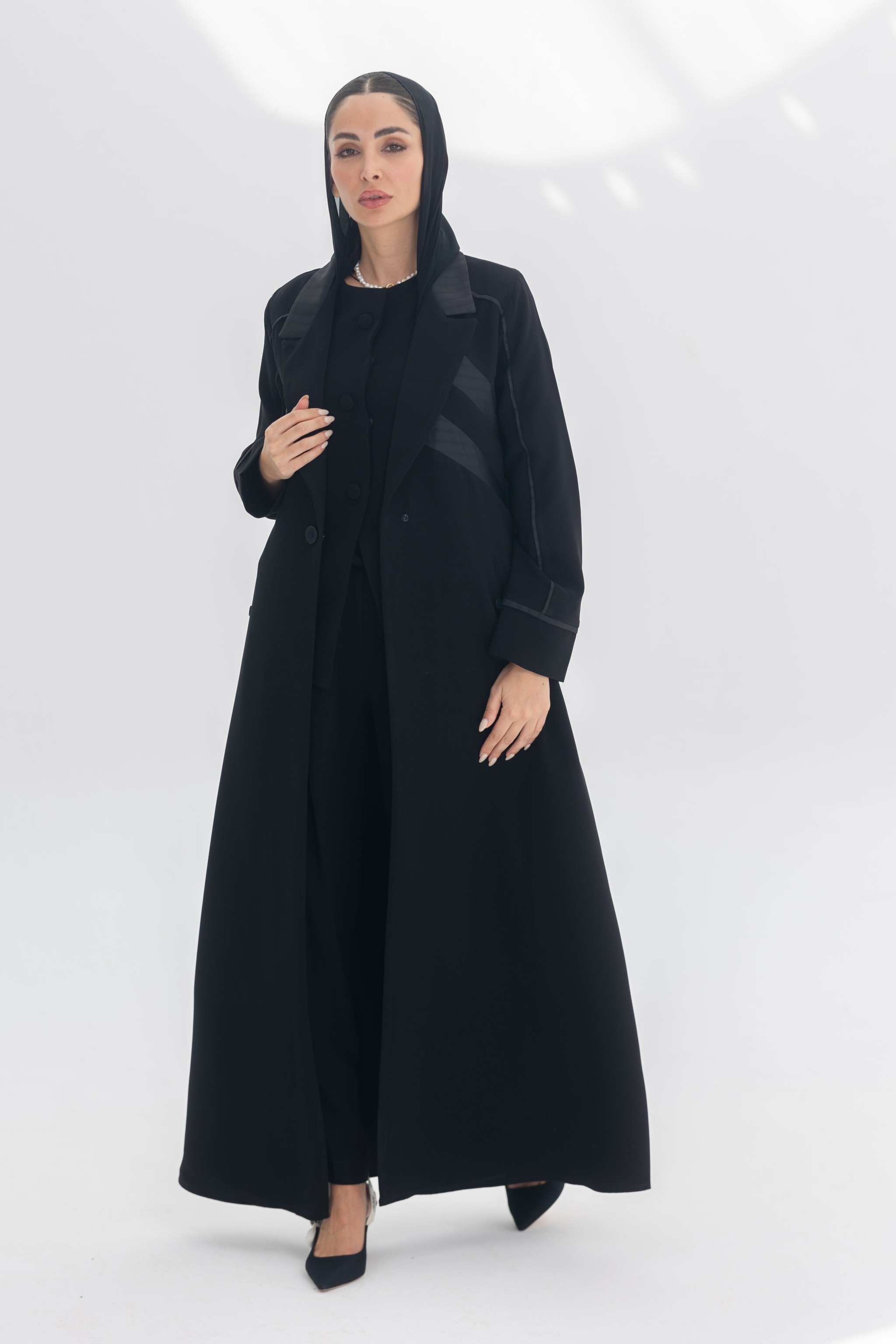 Noira Belle black crepe abaya with striped satin panels and modern elegant design