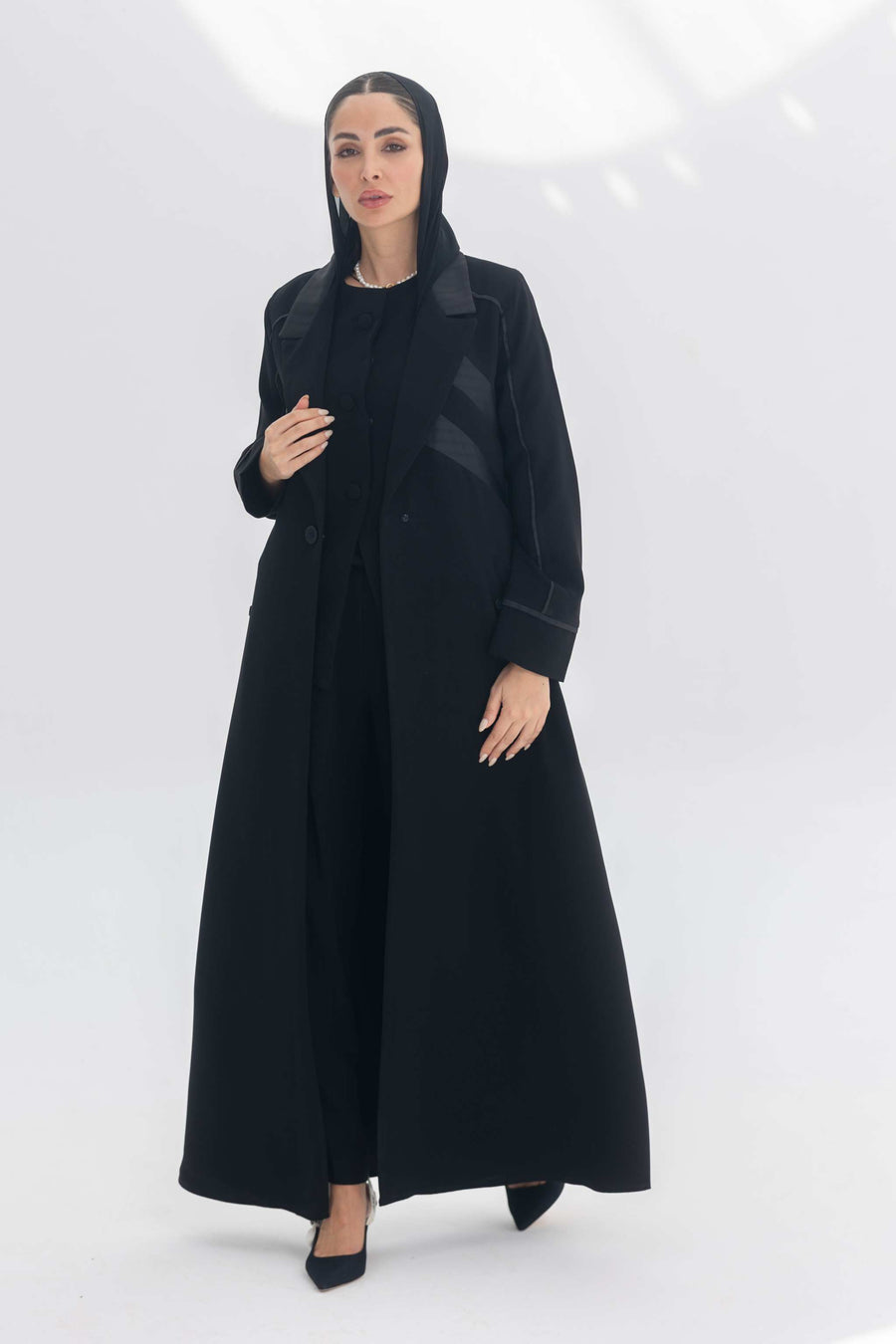 Noira Belle black crepe abaya with striped satin panels and modern elegant design